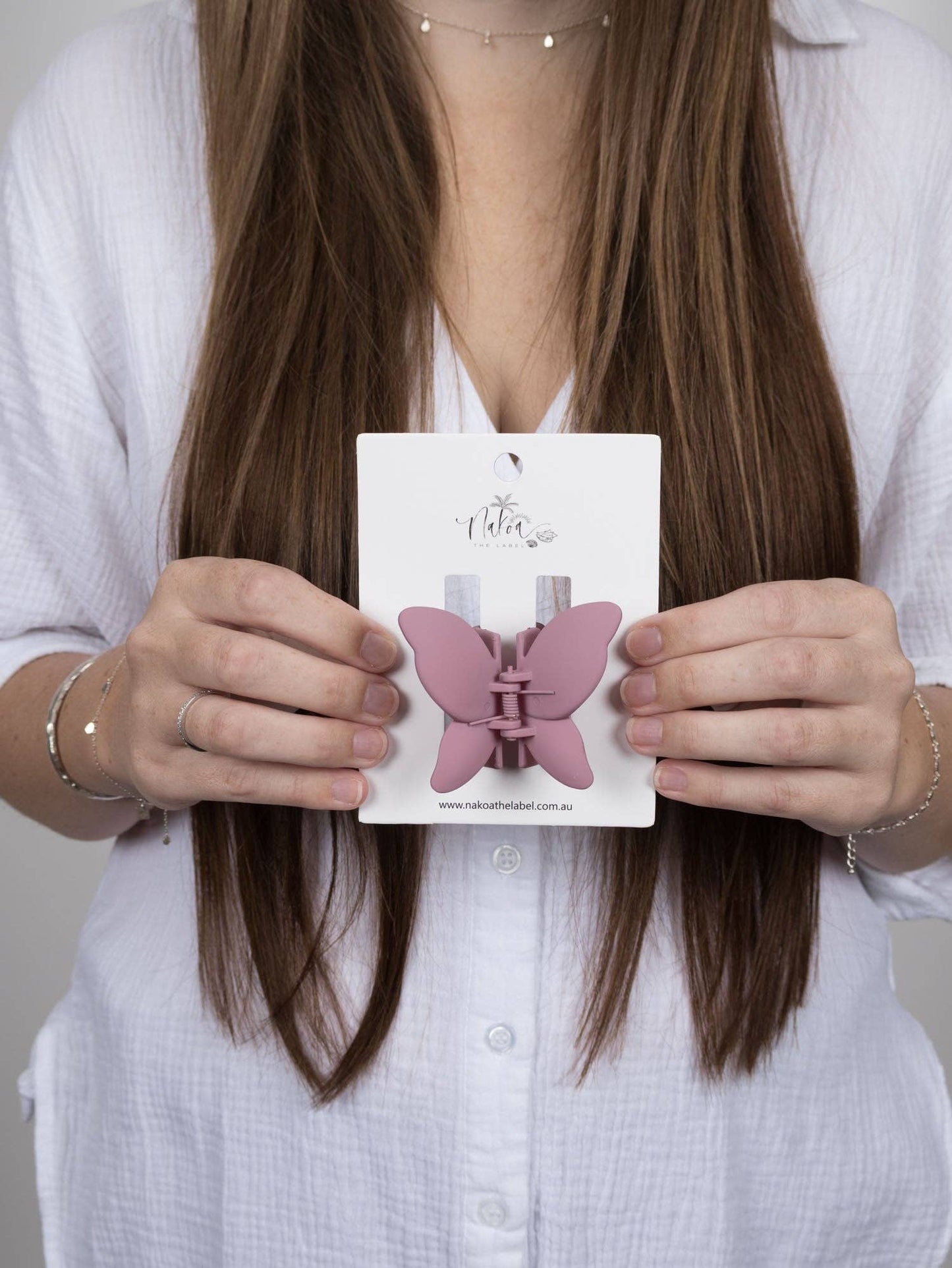 Grape butterfly claw clip- a feminine, playful hair accessory.