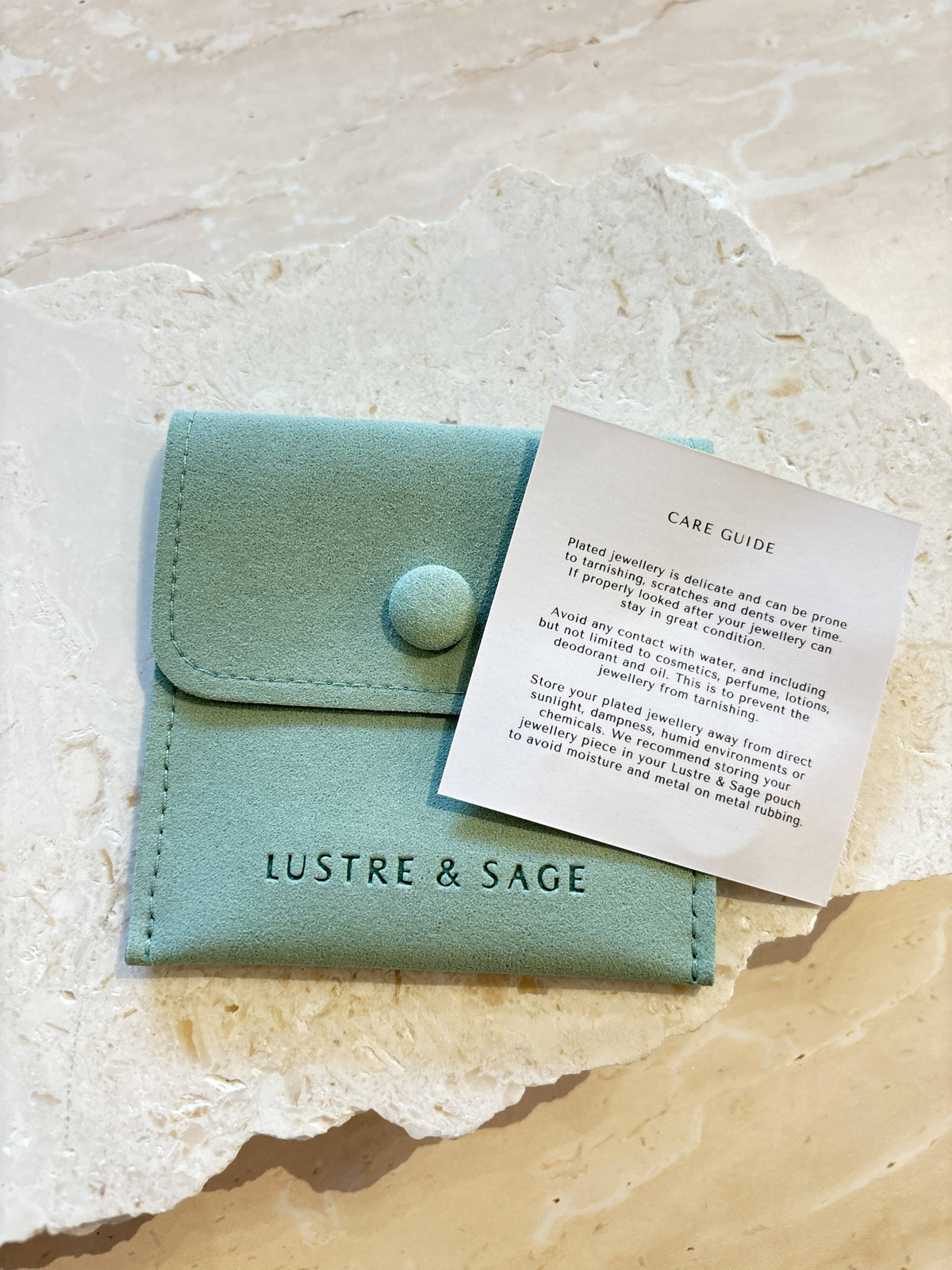 Lustre & Sage faux suede pouch and care guide included with Porte Hoop earrings.