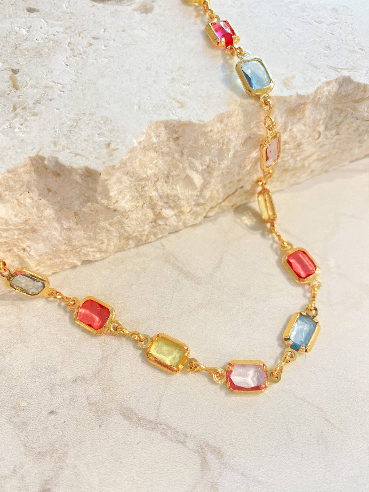Lustre & Sage gold plated necklace collection flat lay.