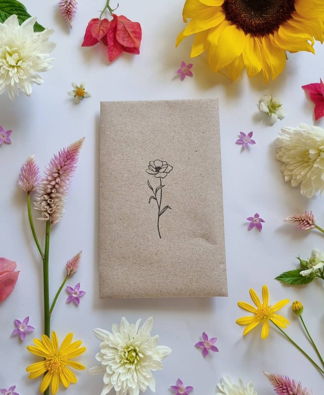 Packet of wildflower seeds with featuring an illustration of a flower.