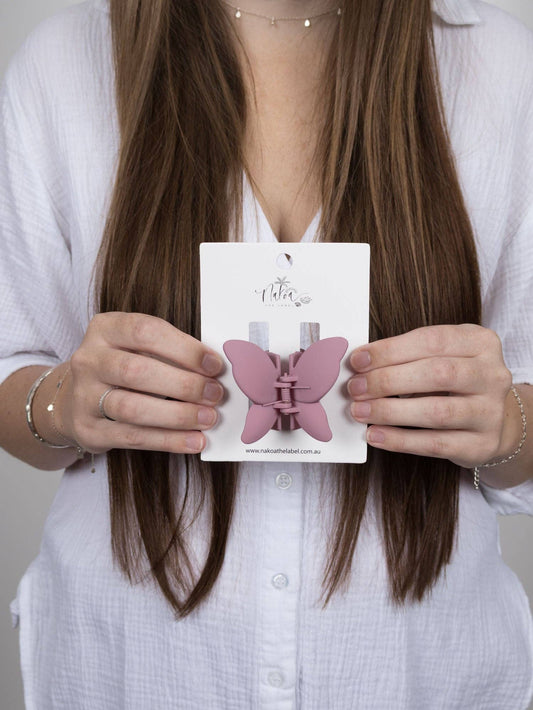Grape butterfly claw clip- a feminine, playful hair accessory.