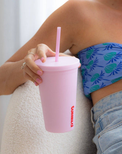 Insulated tumbler/coffee cup with a lid and straw in watermelon colour, designed to keep beverages hot or cold with a sleek, modern finish.