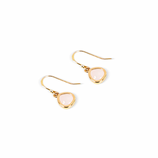 A pair of gold-tone drop earrings with teardrop-shaped pale pink glass stones, shown on a plain white background.