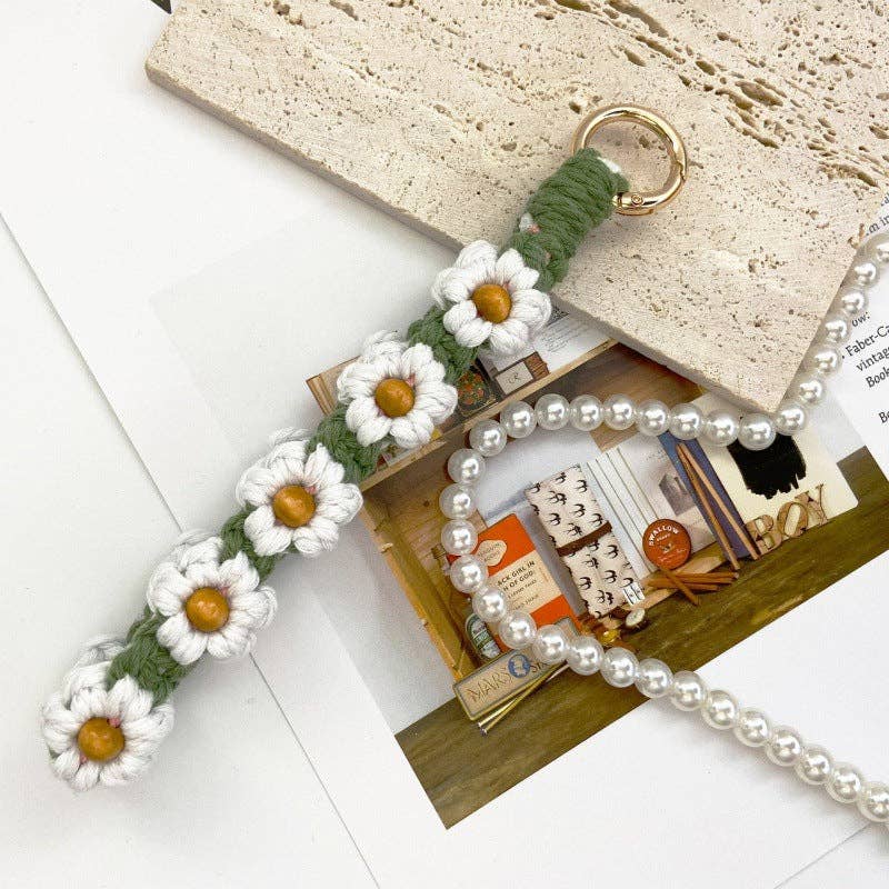 White and yellow crocheted daisy phone lanyard, featuring delicate daisy flowers for a cheerful, handmade touch.