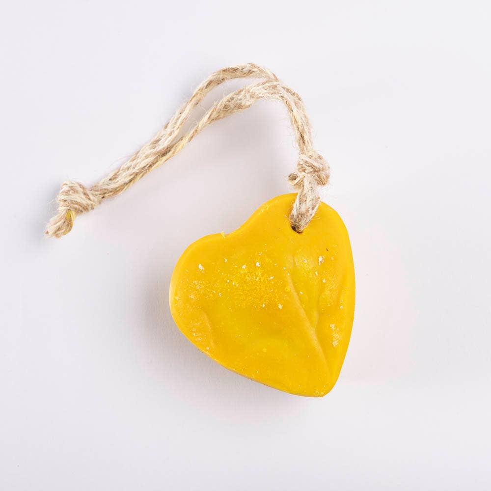 Heart-shaped mandarin and lime soap in a  warm citrus tone, threaded with natural jute for a fresh, handmade  look.
