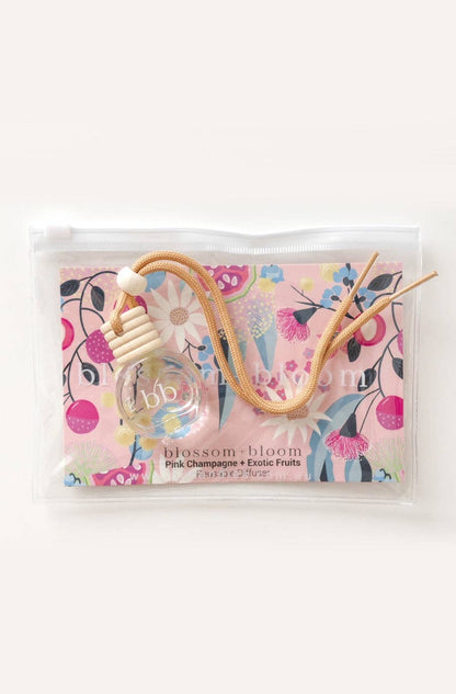 10 ml reusable diffuser with a pink champagne and exotic fruits scent, packaged in a sleek bottle with a lovely floral packaging for a refreshing and elegant touch.