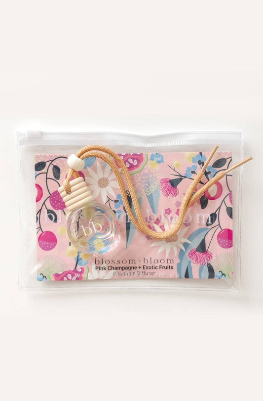 10 ml reusable diffuser with a pink champagne and exotic fruits scent, packaged in a sleek bottle with a lovely floral packaging for a refreshing and elegant touch.