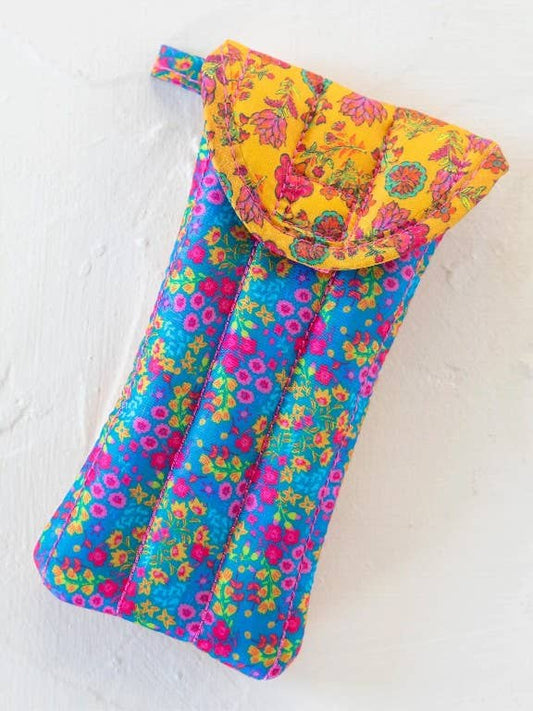 Colorful floral-patterned glasses pouch on a white background