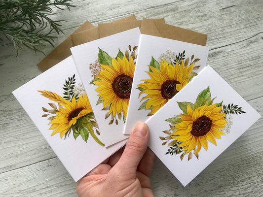 A hand holds SUNFLOWERS cards set of 4: Mini set.