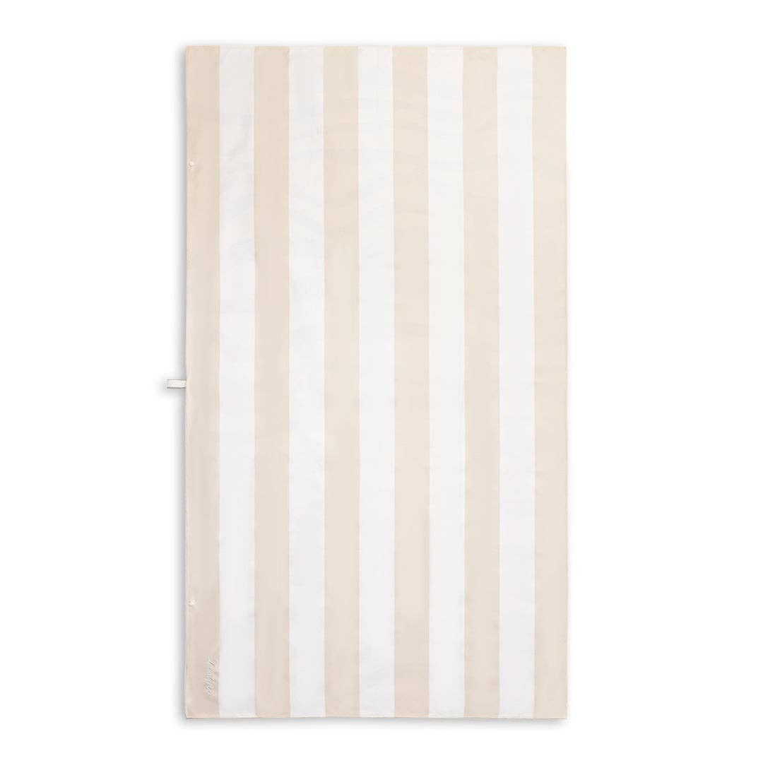 Sand-Free Beach Towel with beige and white stripes, inspired by the natural colours of sand, creating a warm beachy look.