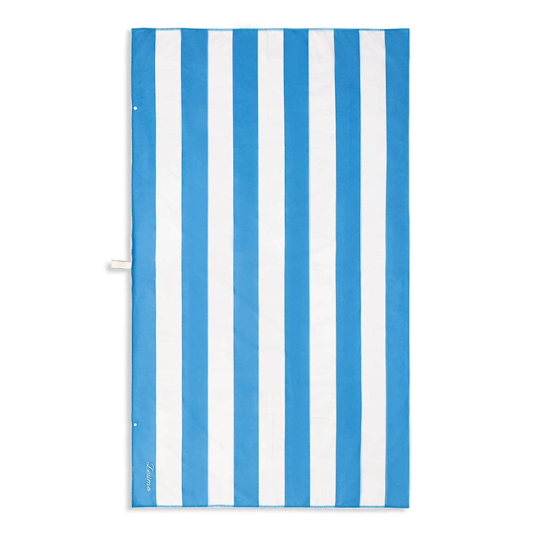 Sand free beach towel with bold Santorini blue and white stripes, offering a crisp, nautical-inspired design.