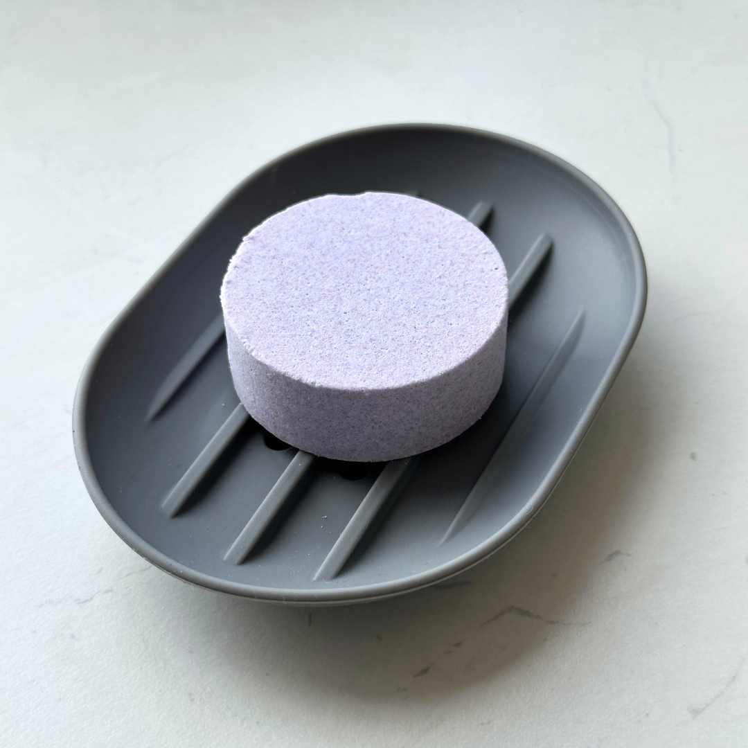 Silicone Shower Steamer Holder in grey with shower steamer tablet, top view