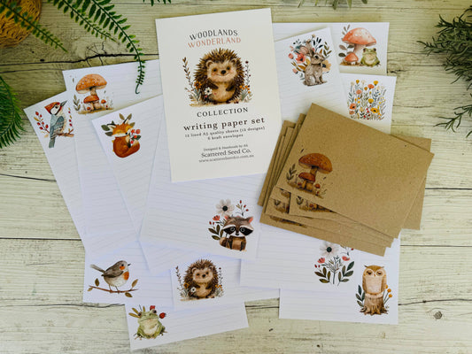 Woodland-themed writing paper set with envelopes on a wooden surface
