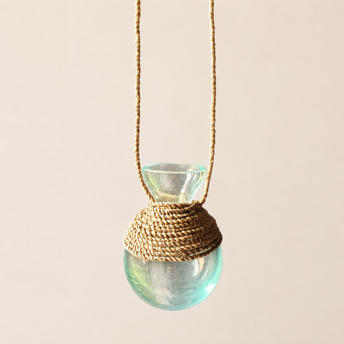 Handblown recycled glass propagation vase, side view.