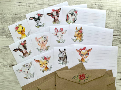 Set of farm animal-themed floral lined writing sheets and envelopes on a wooden surface