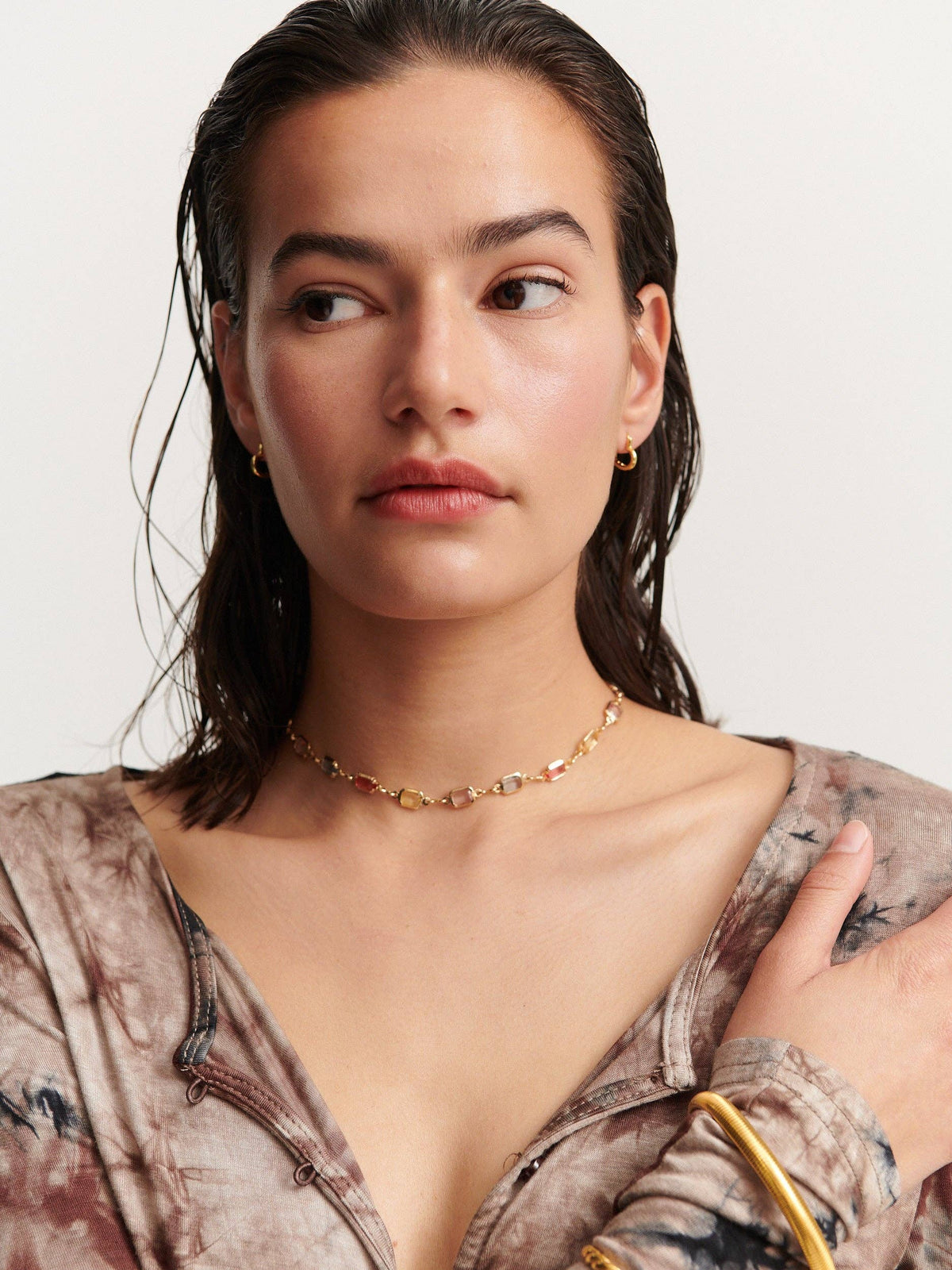 Sorrento Gem gold necklace styled on model, editorial shot.